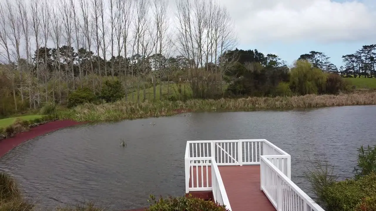 drone fly through the pinky balcony by the lake