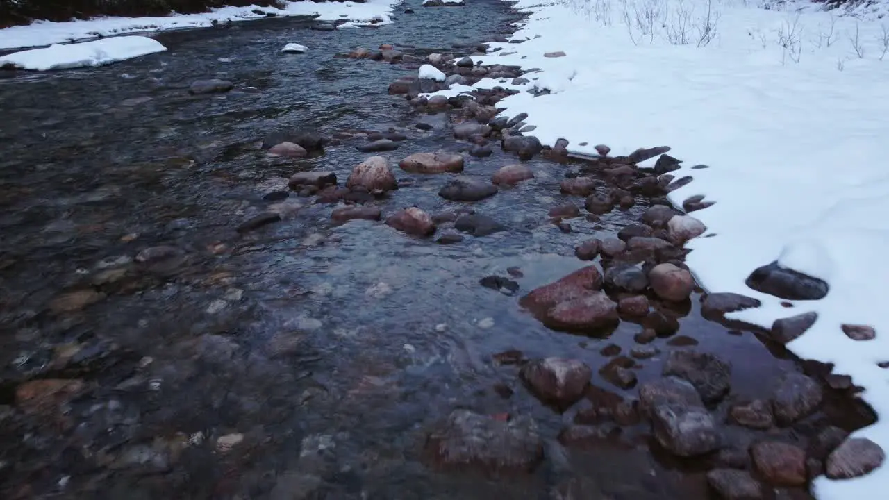 Creek mountain slow reveal in winter snow