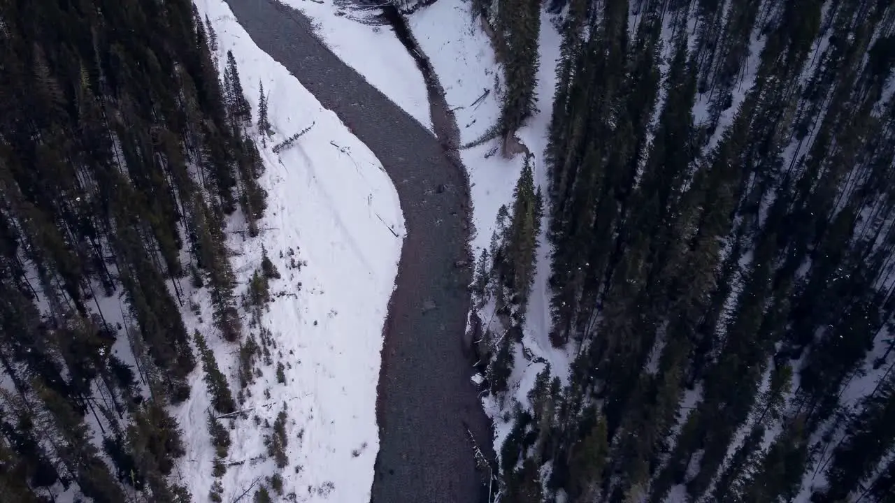 Creek and road in mountains winter