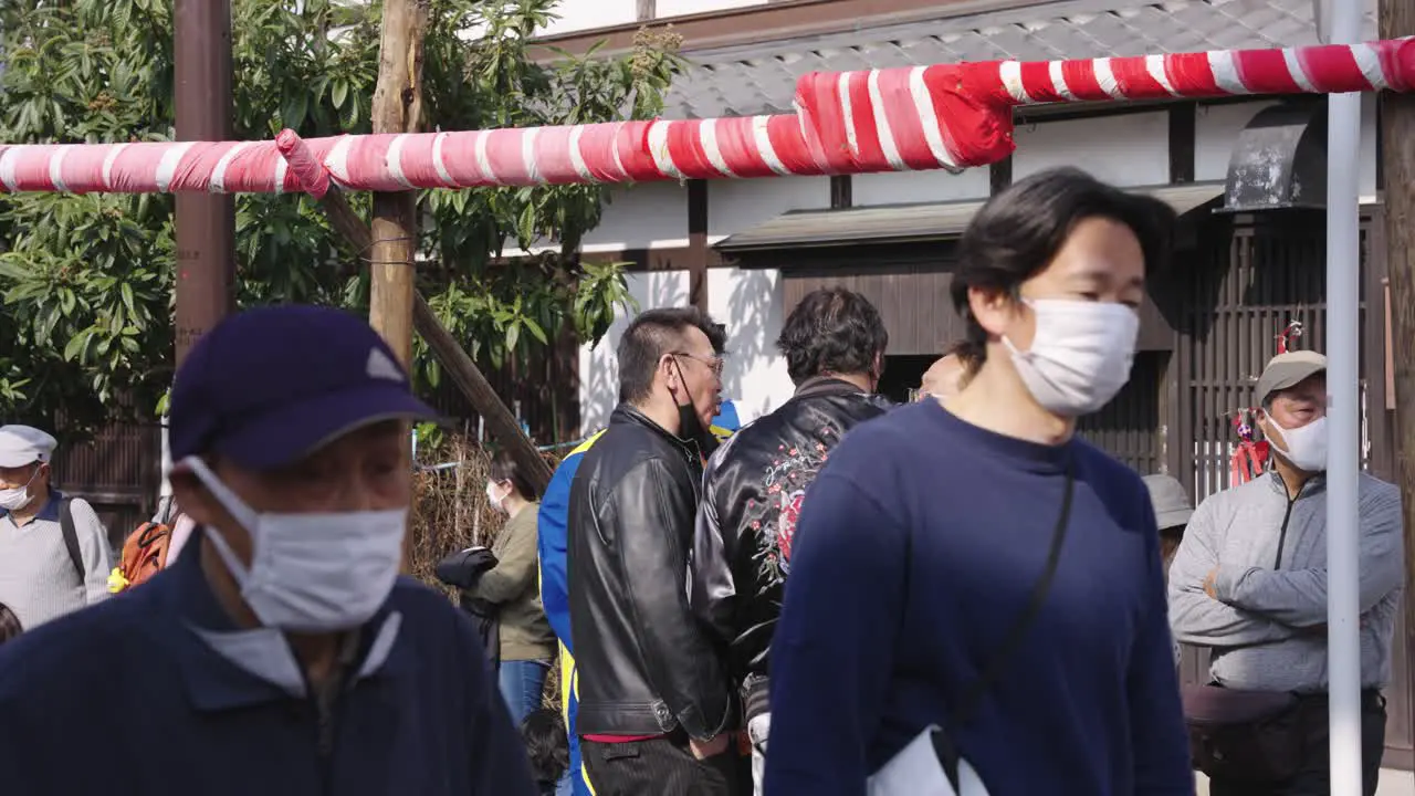 Japanese people wearing masks at festival during Spring