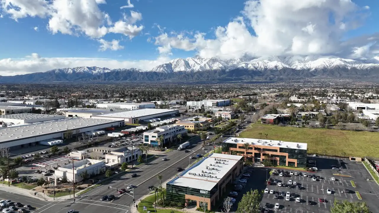 Factories Ontario CA with a active crossroad and mountains in the background