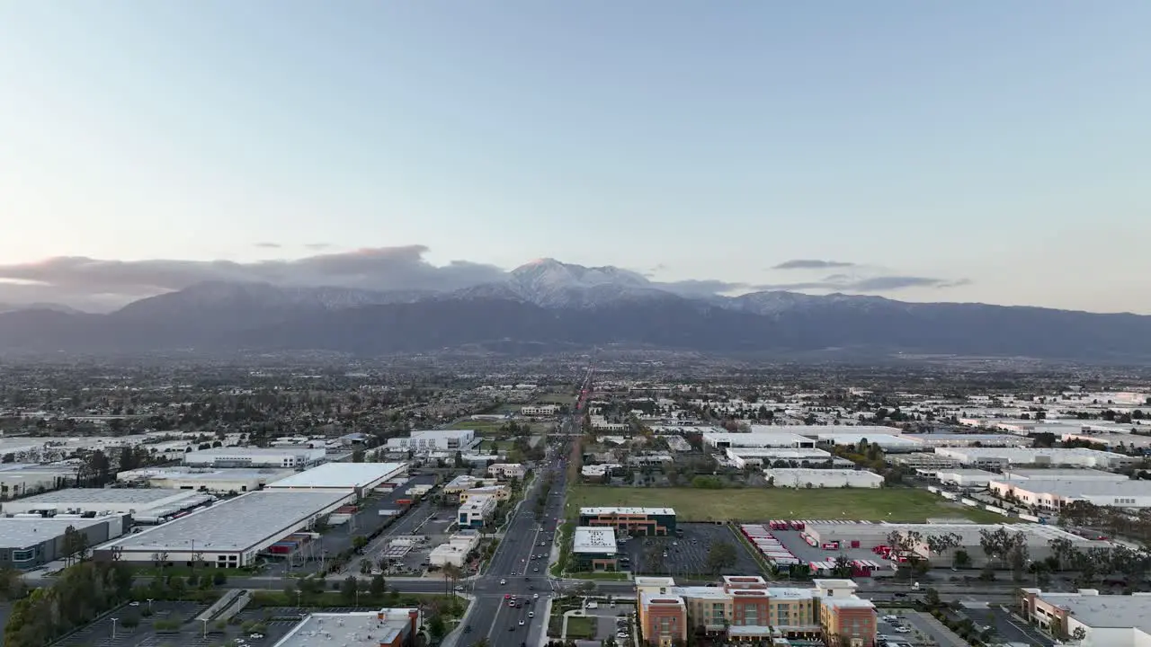 slow back up motion of Ontario town at sunset looking at the mountains