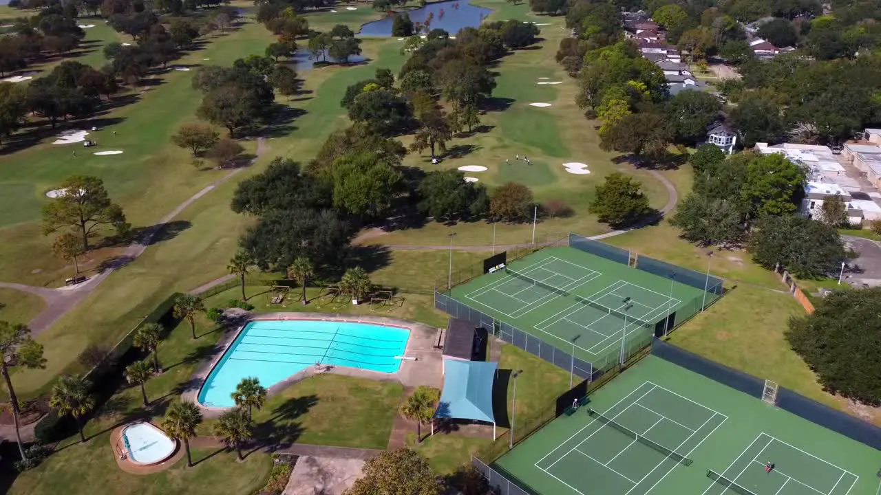 Aerial view of Golf course with tennis courts and a swimming pool at 60 frames