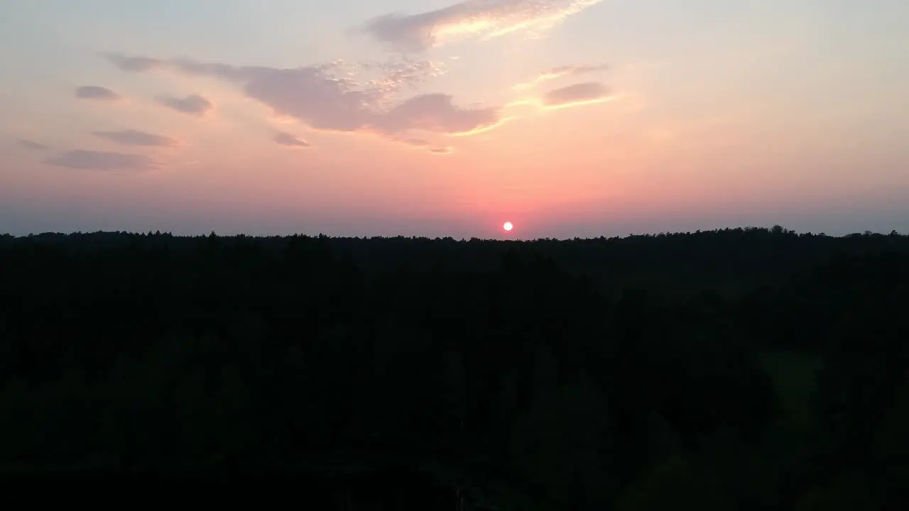 Sunset in the woods filmed from drone