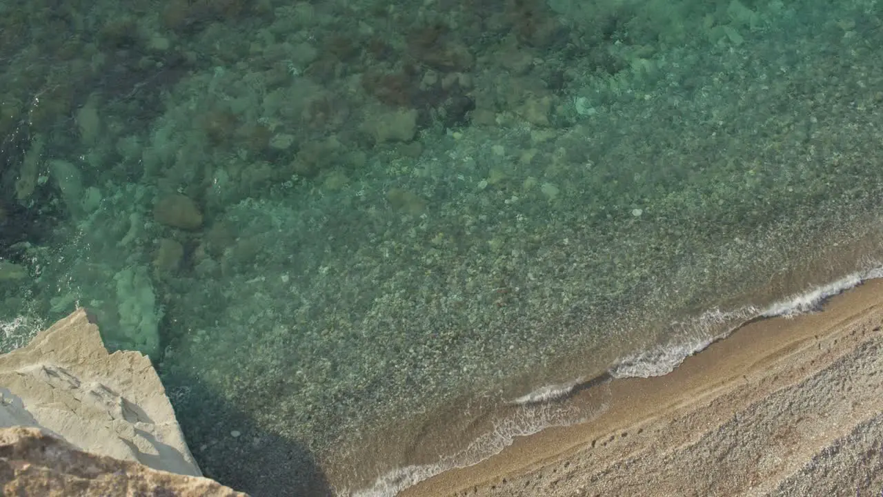 Slow Motion Emerald and Turquoise Transparent Mediterranean Sea and Waves From a Top Of A Cliff in Cyprus