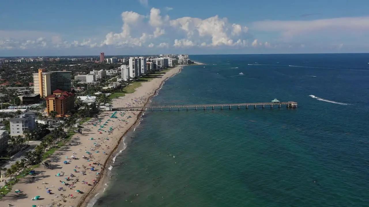 Aerial hovering over a florida pier on the ocean