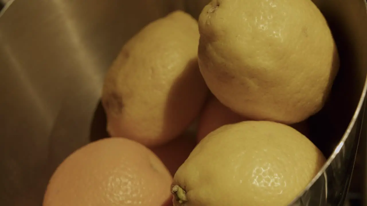 Some fresh lemons in a metal pot