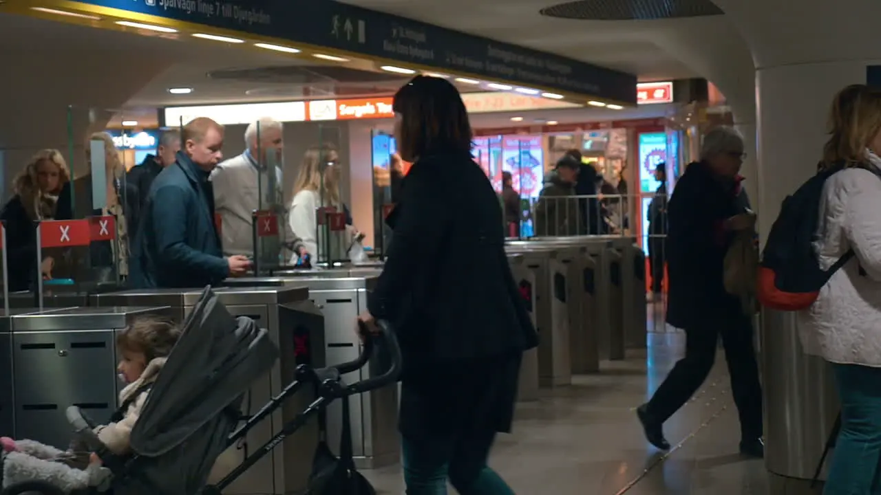 People coming through the subway wicket