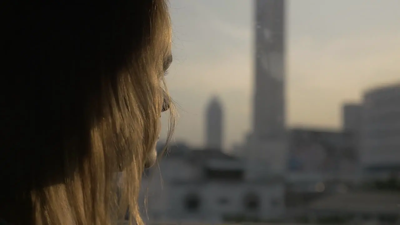 Woman looking out the window during bus ride in Bangkok Thailand