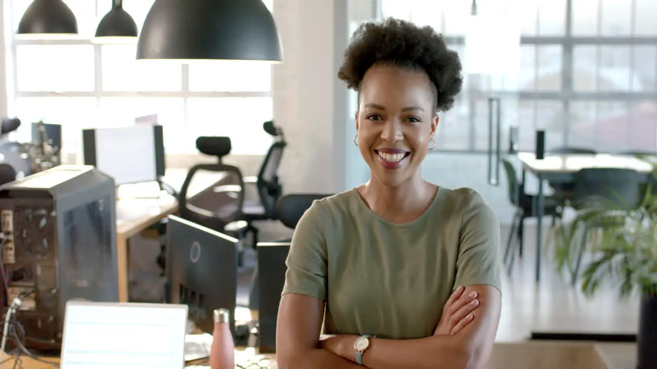 Confident African American businesswoman stands in a business office