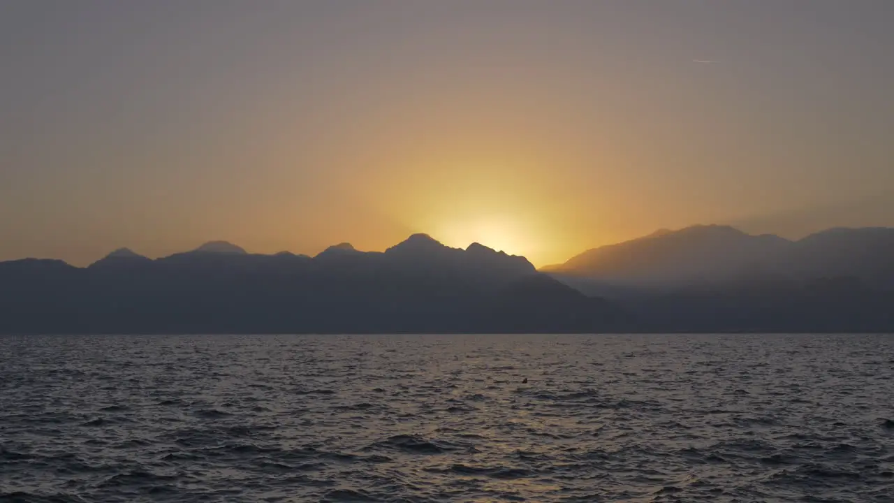 Seascape with mountains and sunset