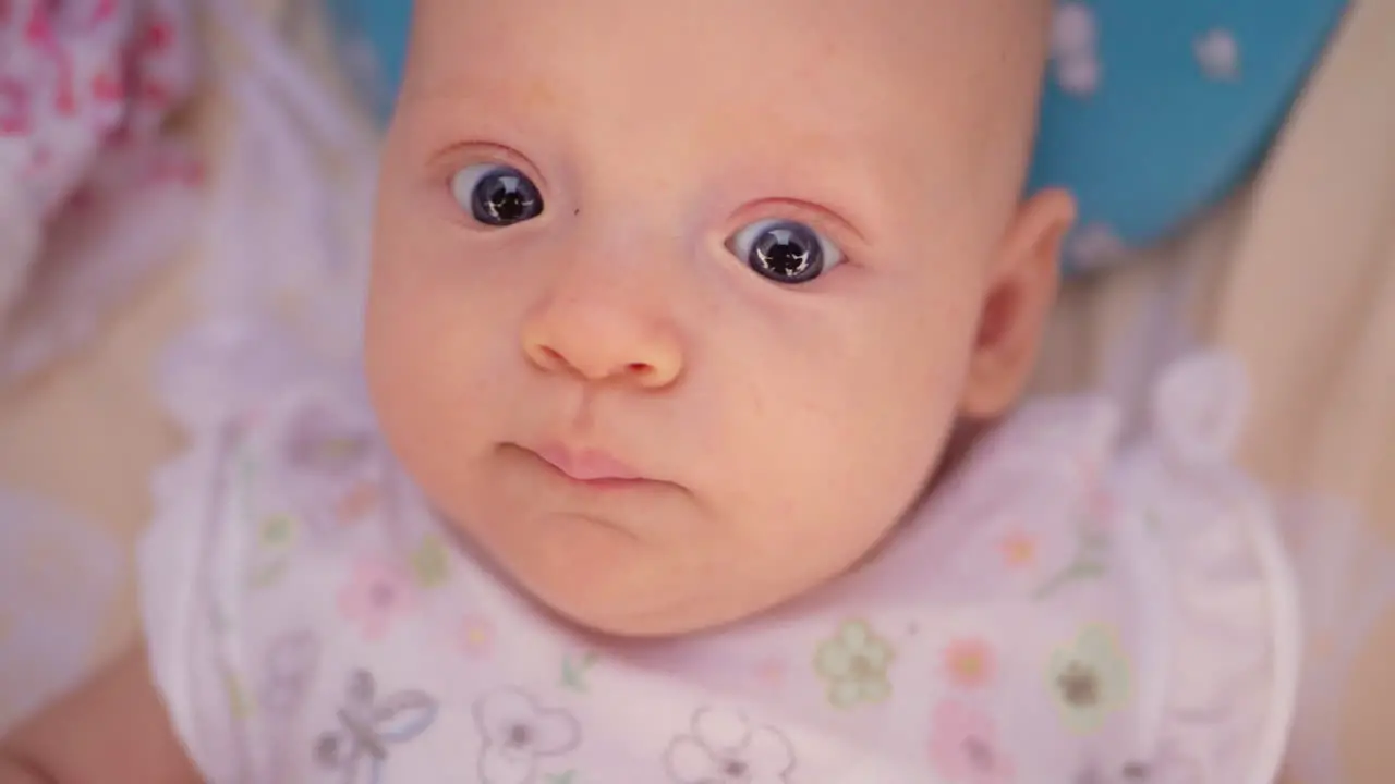 Cute three months baby girl with big blue eyes