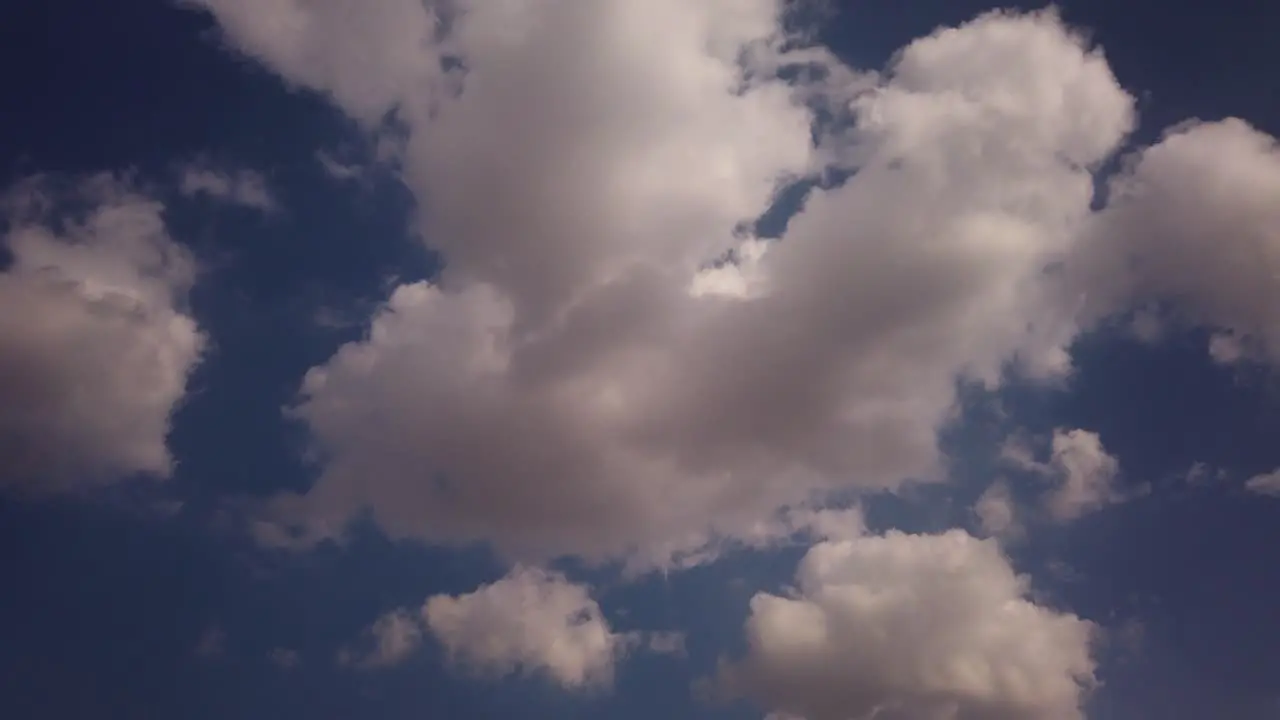 A time lapse of clouds that disappear until only the blue sky is left