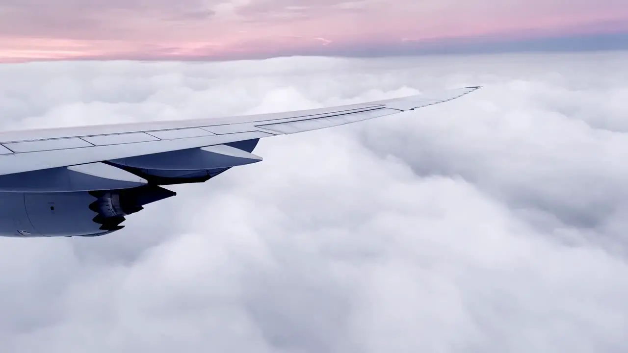 storm clouds at sunrise sunset out airline plane window