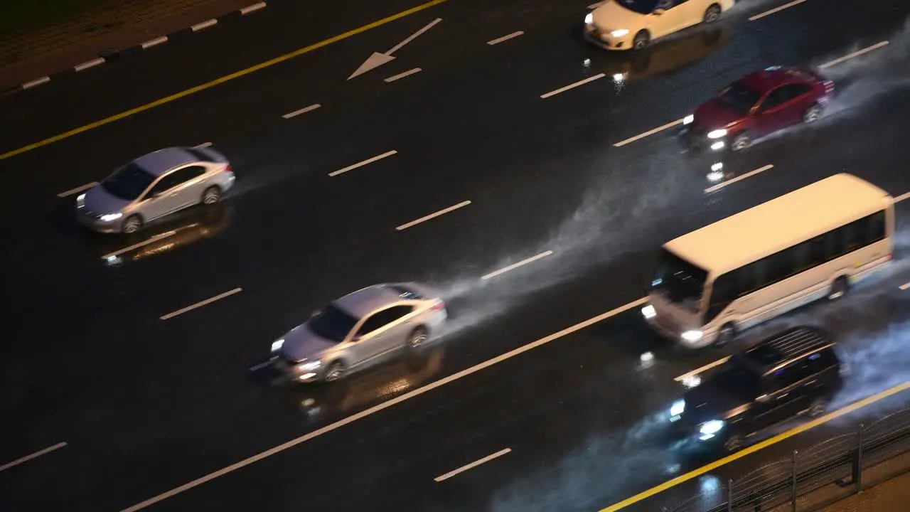 Cars driving on the highway during heavy rain in Dubai