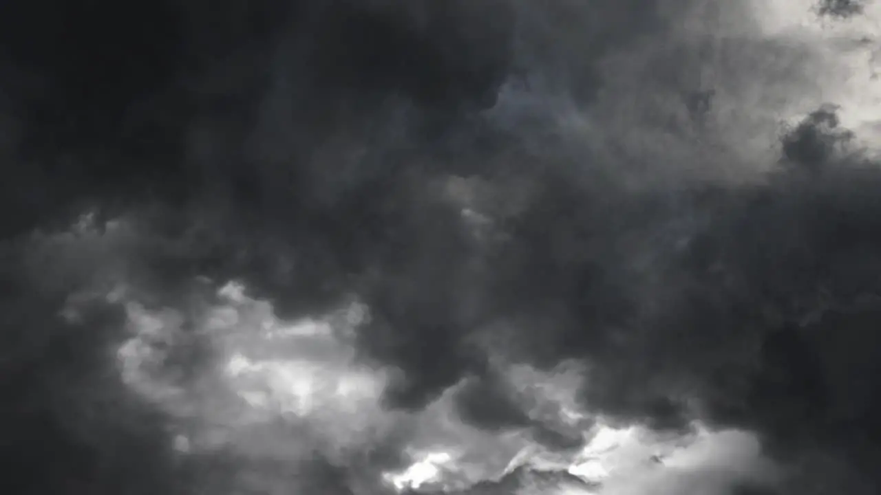 heavy thunderstorm clouds lightning bolts strike ahead