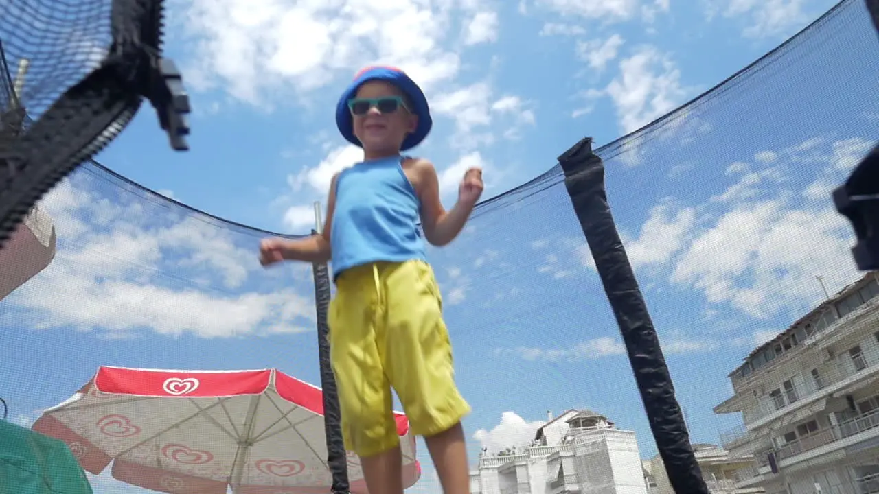 Little child having fun on tramp outdoor