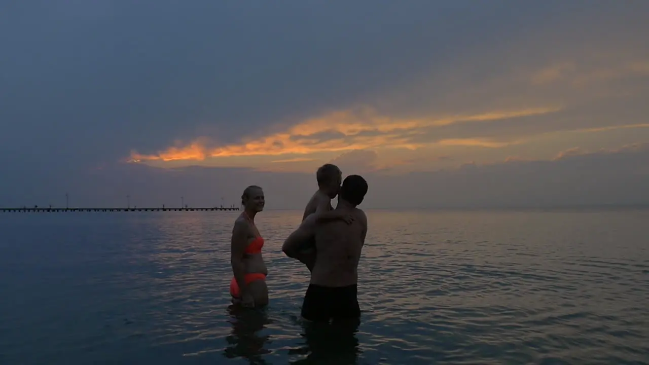 Young family with a child went into the sea