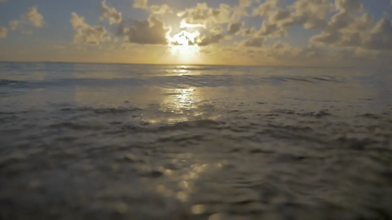 Sea waves on the shore at sunset