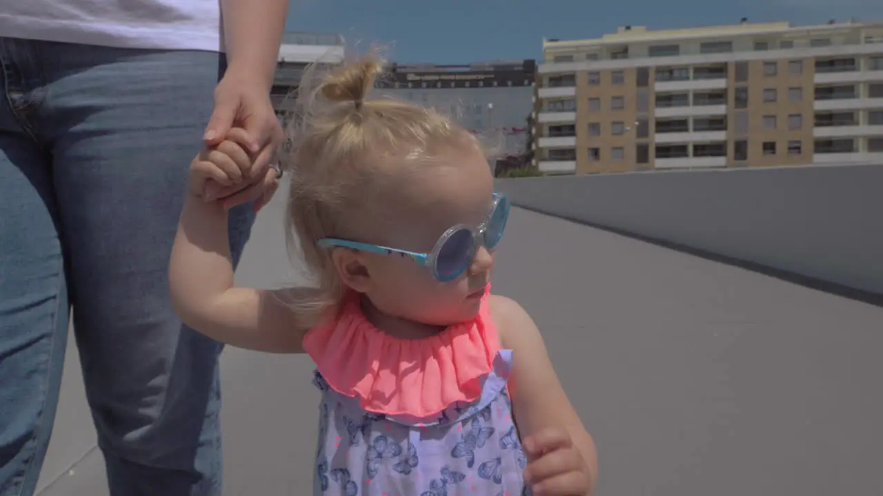 Fashionable little girl in sunglasses