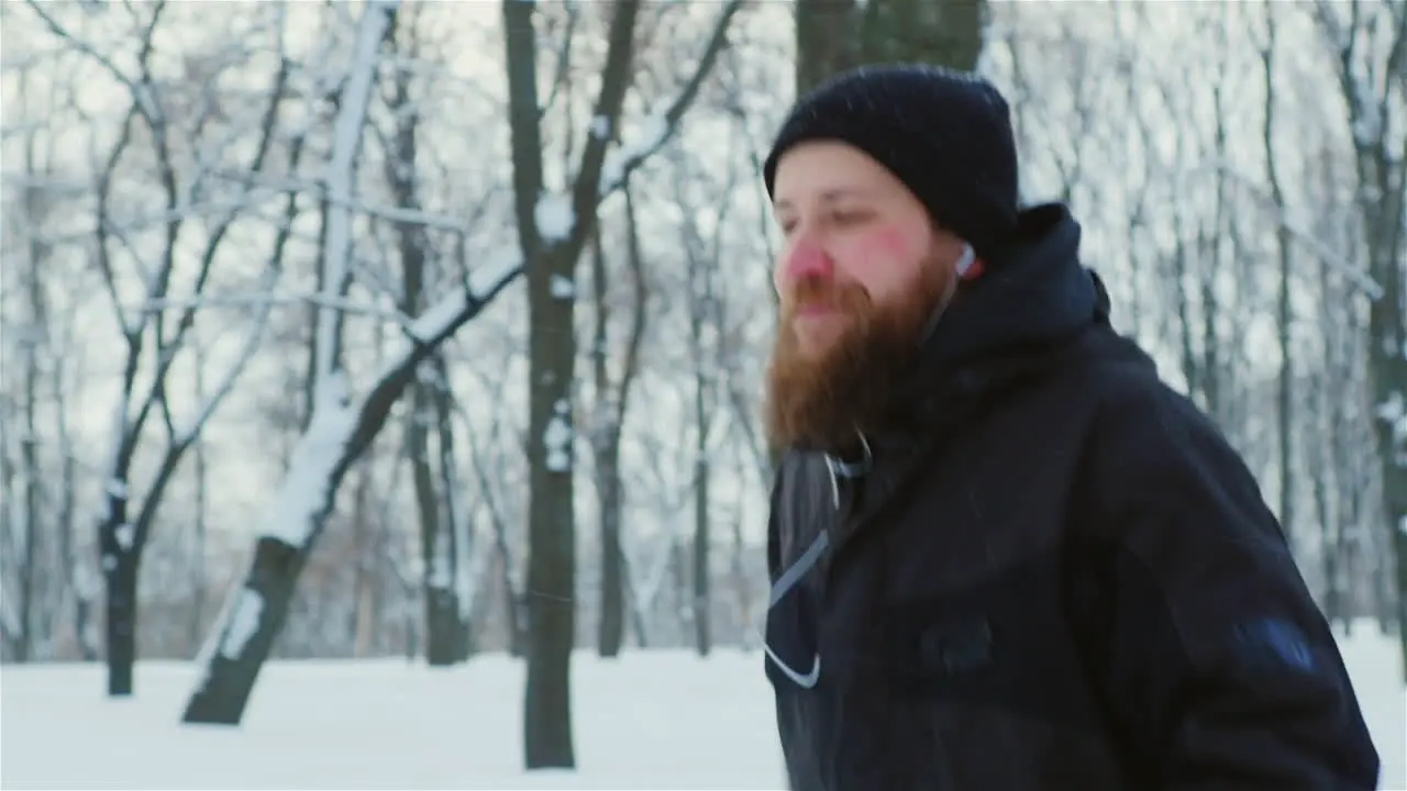 A Man Running In A Winter Park 01