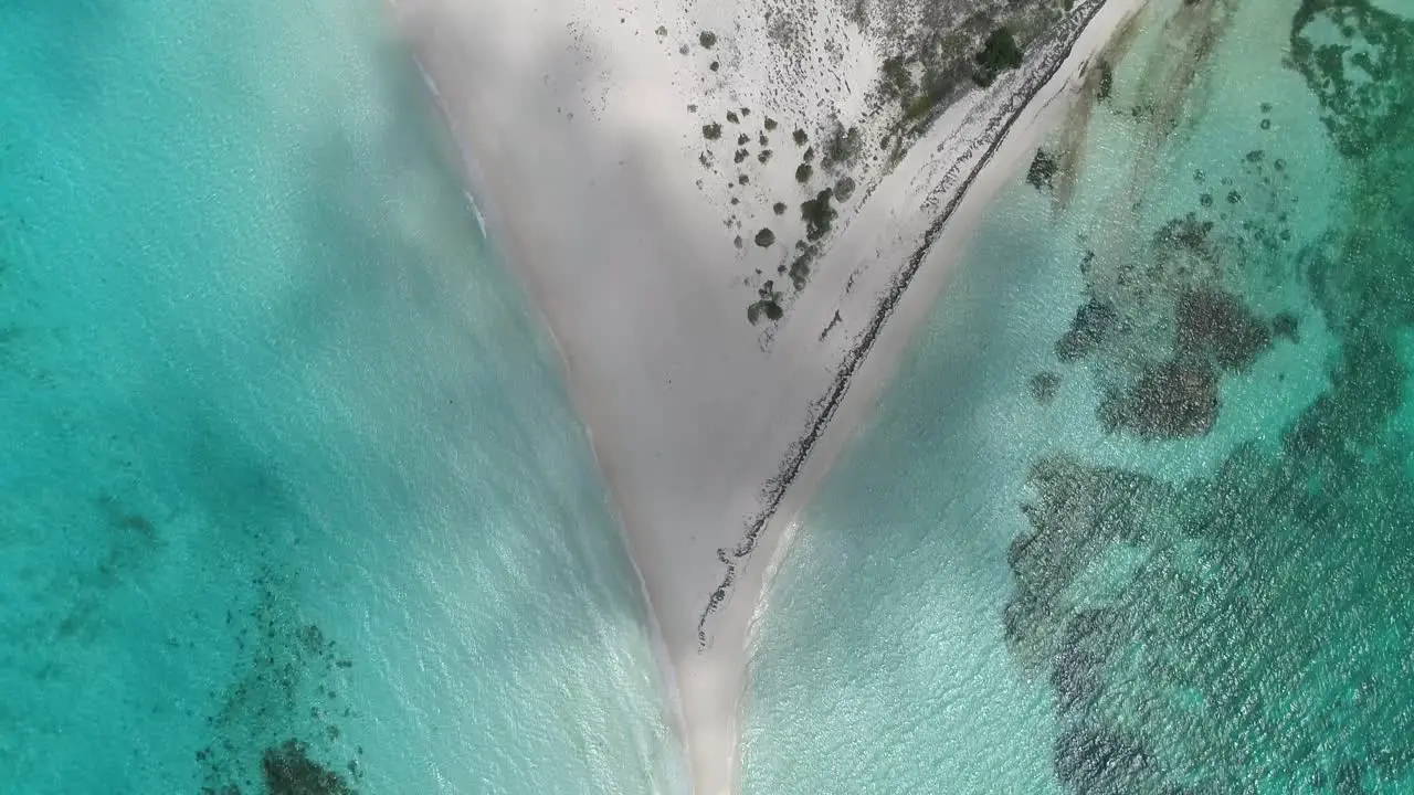 Drone zenith view over tropical sandbank shades of blue sea water texture Cayo de Agua