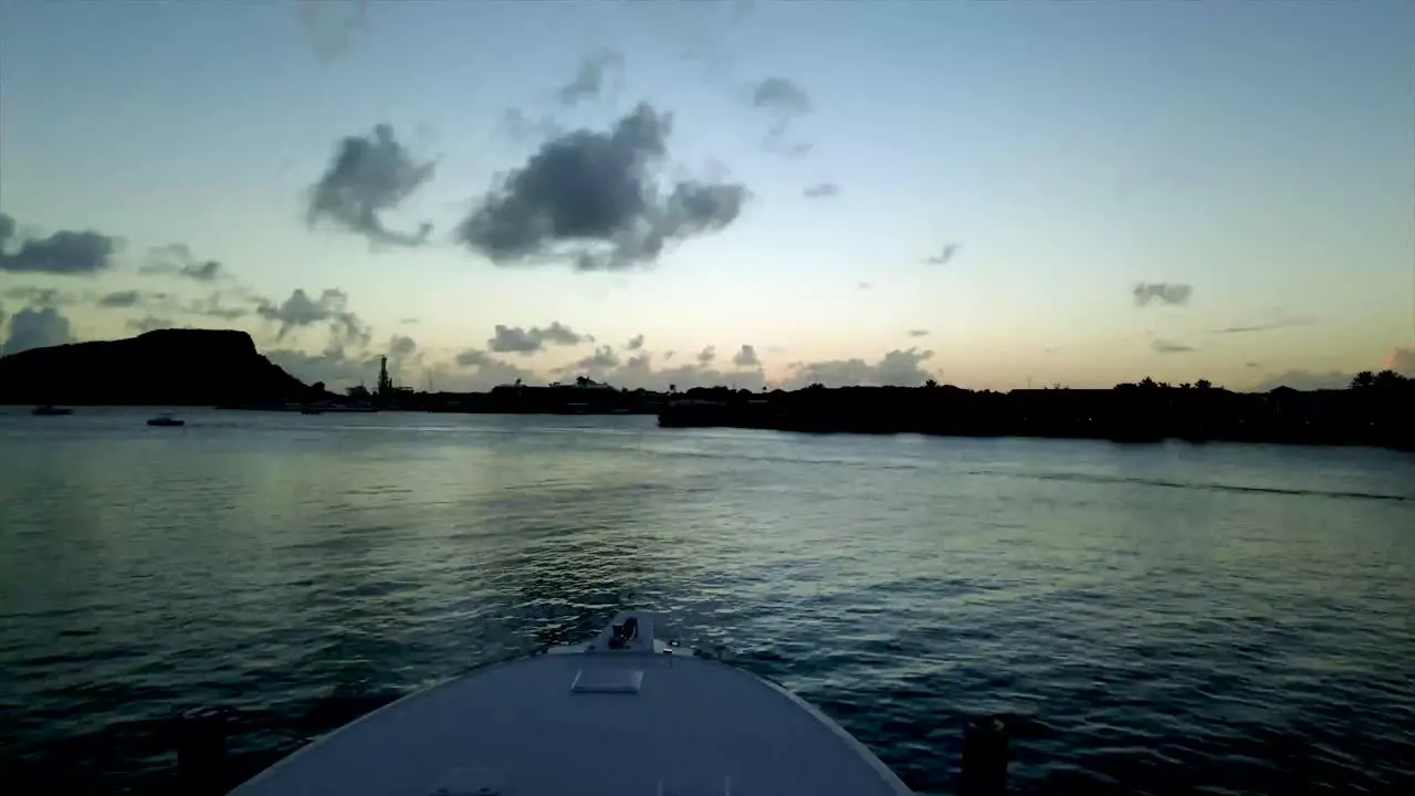 Motion lapse with dji osmo pocket of boats on the water with a sunset and mountains in the background clouds