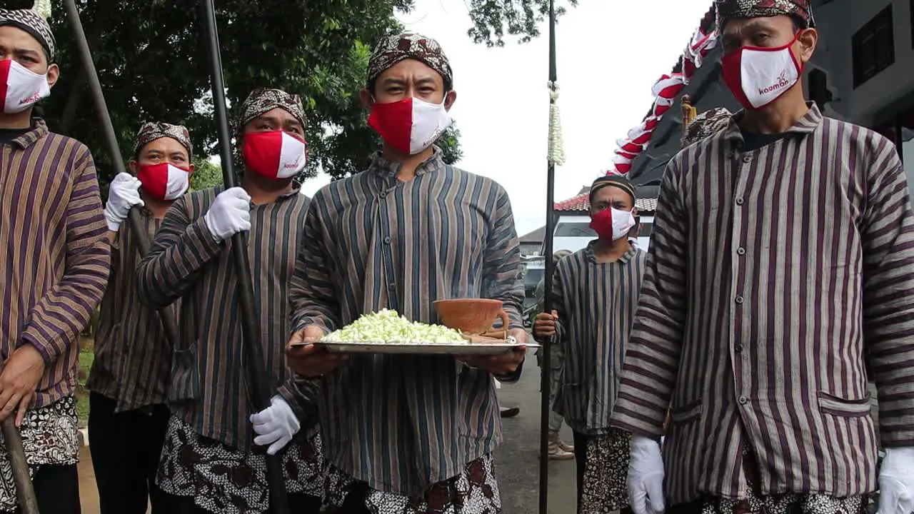 Javanese man burning incense before the traditional procession Batang Indonesia April 5 2021