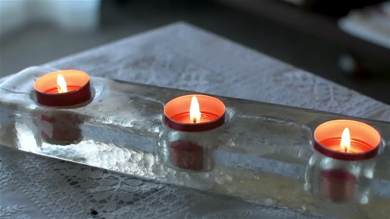 Top view of three scented candles on a table in the house