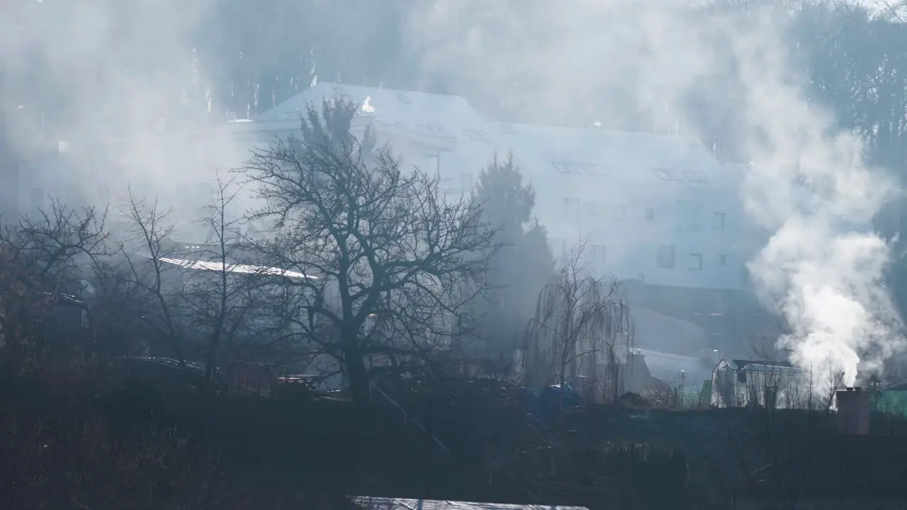 Smoke rises from the chimney of an old house