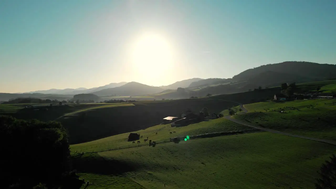 Slow push in flight in a beautyful swiss landscape during sunrise