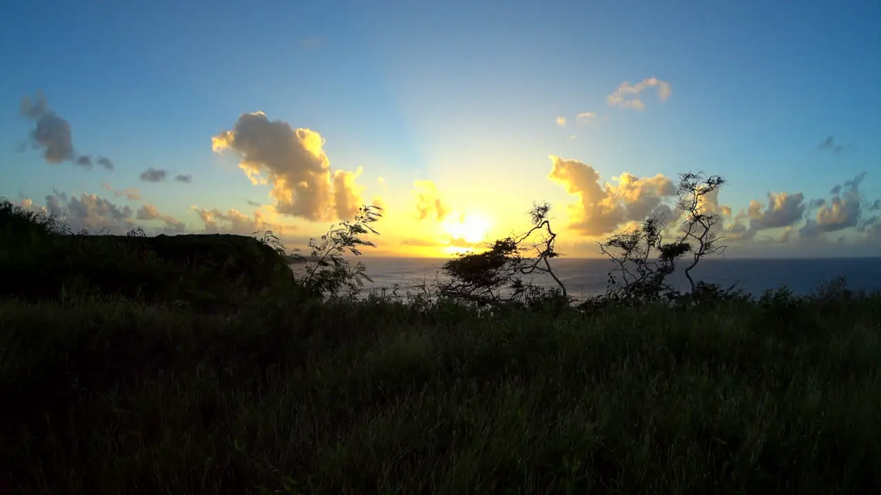 Timelapse from a cliff top of a breathtakingly beautiful sunset over the Caribbean sea