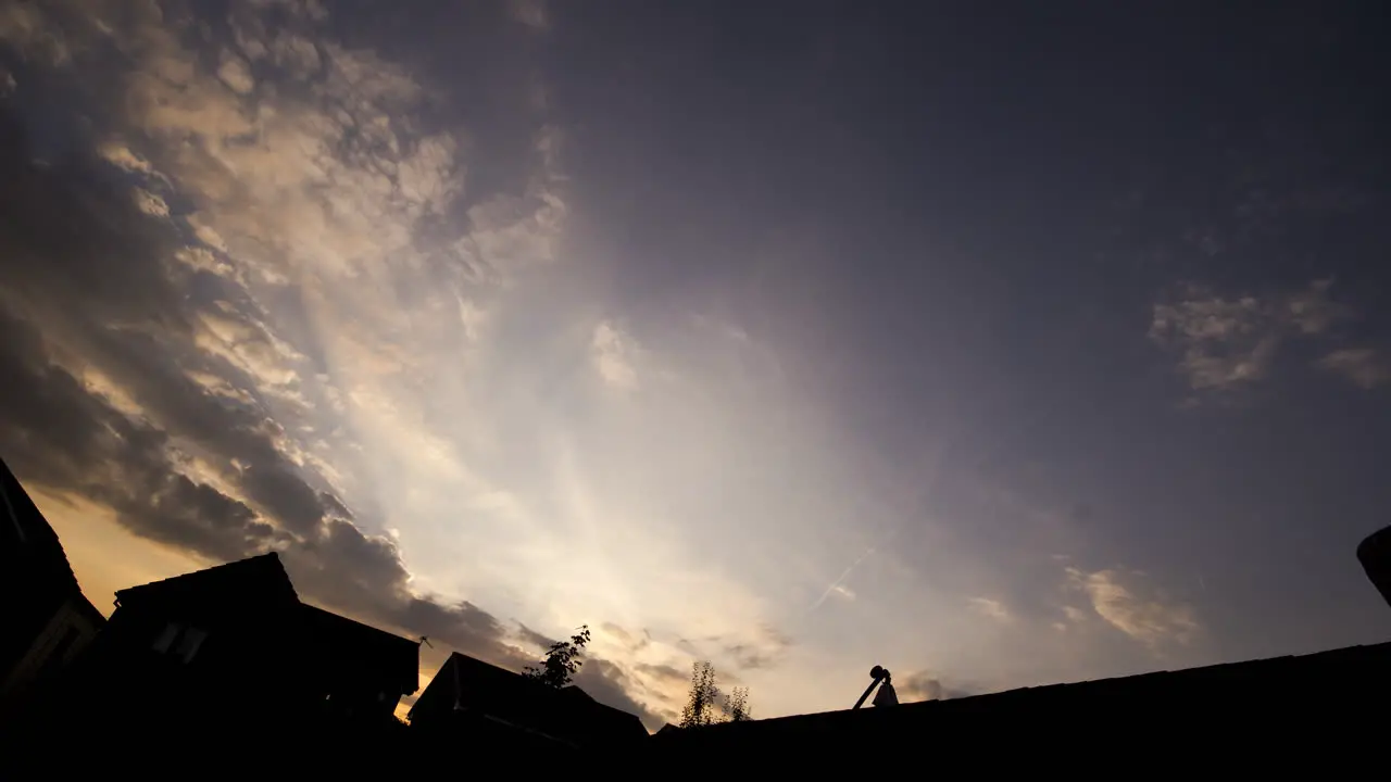 Timelapse of dark menacing clouds at sun set  timelapse speeds up towards the end