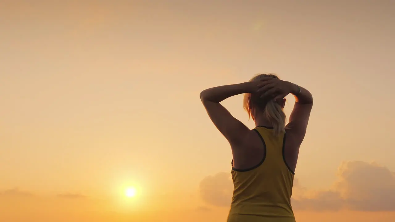 Active Middle-Aged Woman Looks Forward To The Sea Where The Sun Rises Start A New Day And A Healthy 