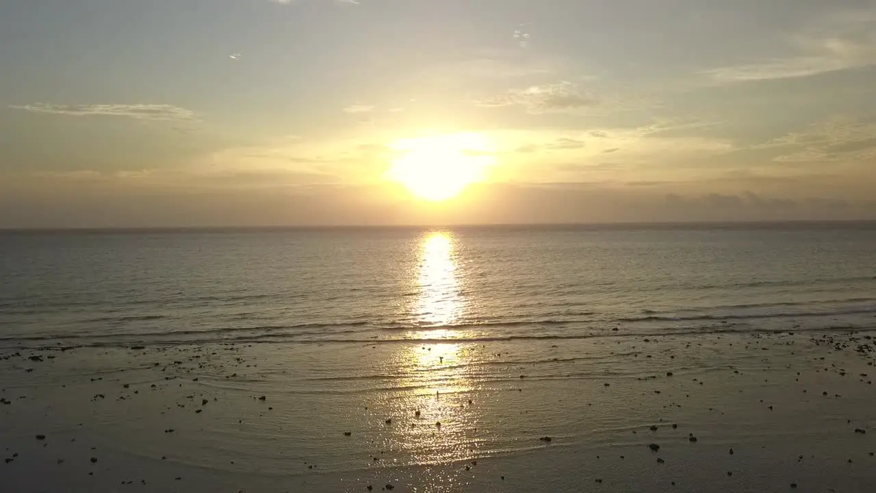 infinity Sun reflected in sea
Daring aerial view flight panorama overview drone footage
of Gili T beach bali Indonesia at sunset summer 2017