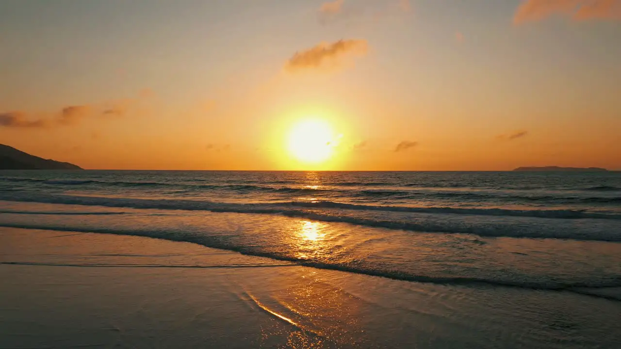 Amazing aerial view over beautiful beach ocean sunrise going forward South America Brazil