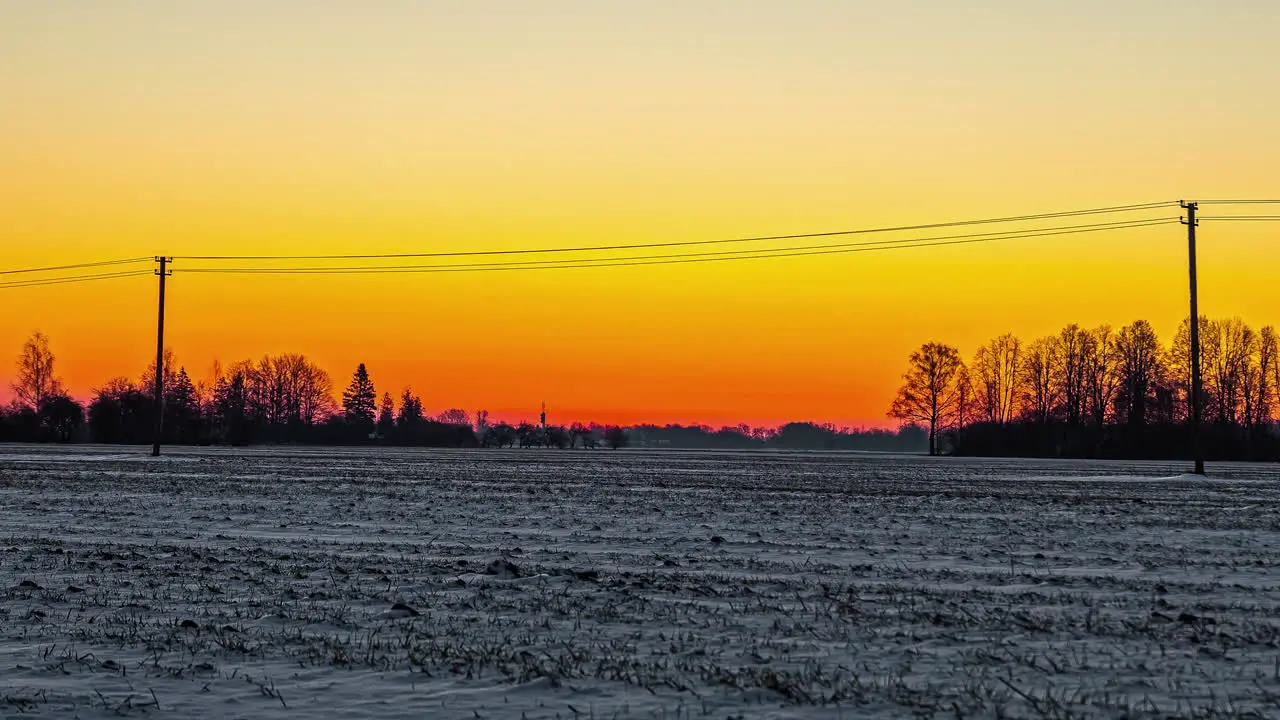 Sun rising above snow capped isolated landscape