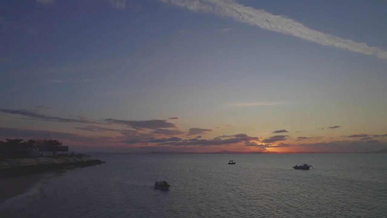 Boats sailing under the sunset of the Great Keppel Island in Australia