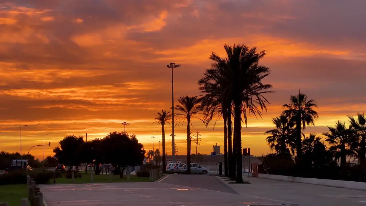 Orange sky at sunset over a fort in Carcavelos near the beach