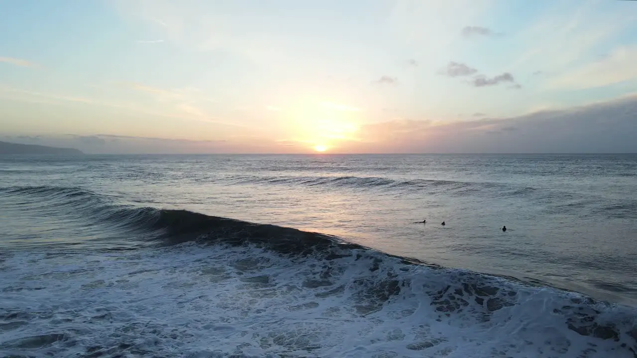 Beautiful O'ahu North Shore waves at sunset Hawaii Pacific Ocean 4K aerial view