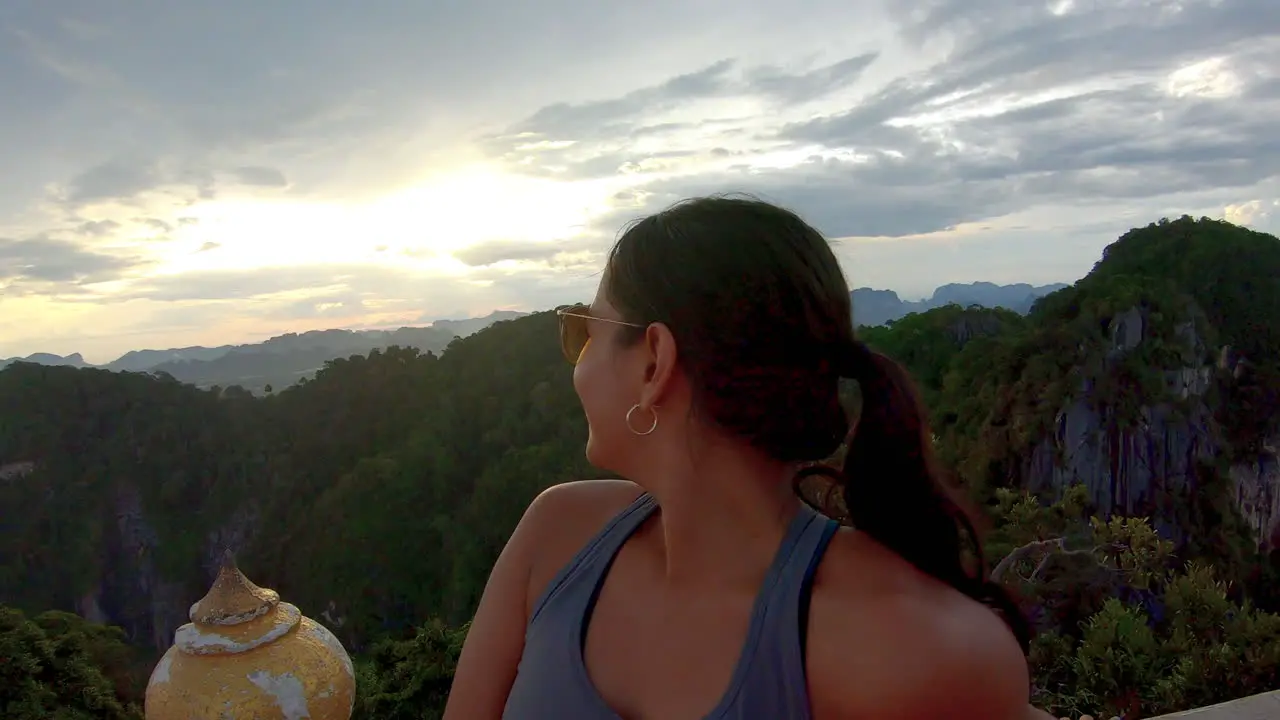 SLOW MOTION | Close up Beautiful Indian Girl on mountain in Thailand -Smiling at sunset