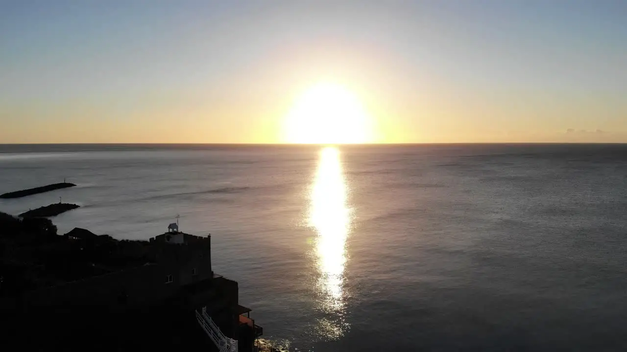 Drone view from Sidmouth South West England looking out over a beautiful sunrise over the English Channel