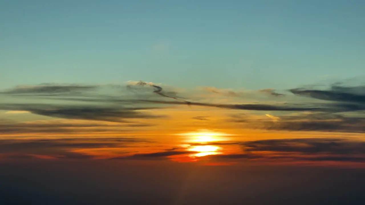 Spectacular sunset over the Mediterranean Sea recorded from a jet cockpit flying westbound at 11000 metres