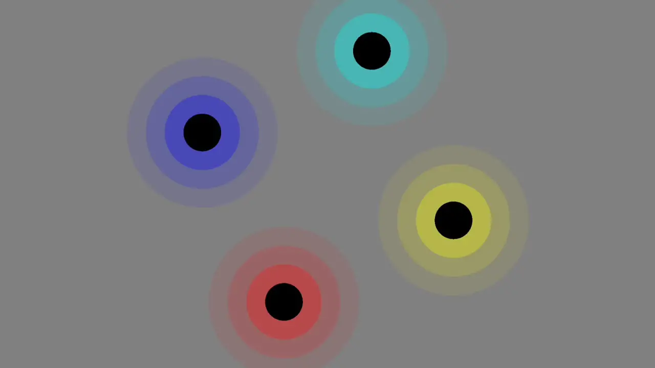 Four colorful circles revolving around center axis