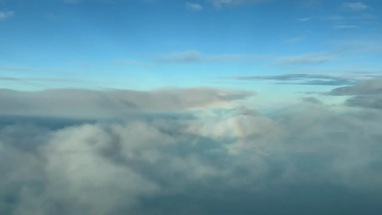 Aerial view of the halo of an airplane over the clouds arriving to Palma de Mallorca airport Spain