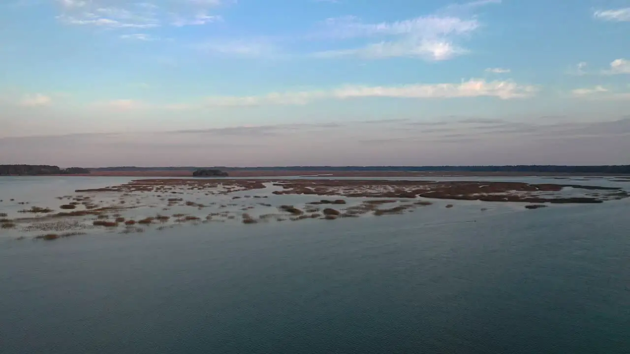 Arial shot over some islands with a beautiful skyline