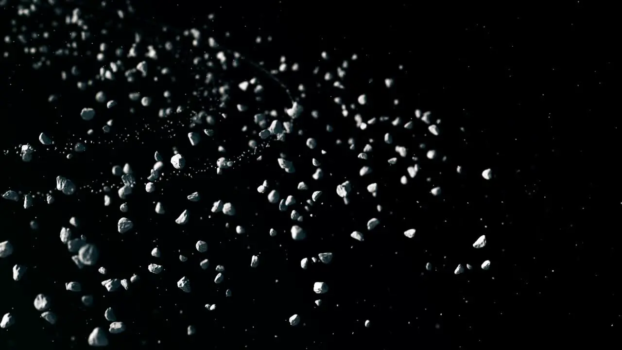 Animated stone particles on dark background simulation of stones and small rocks moving slowly under sunlight in asteroid belt cosmic derbies concept