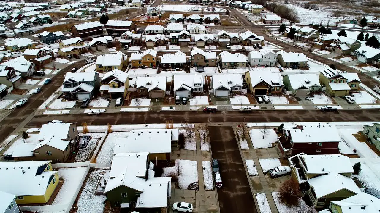 A 4k drone fly over of a suburban neighborhood following a late March storm