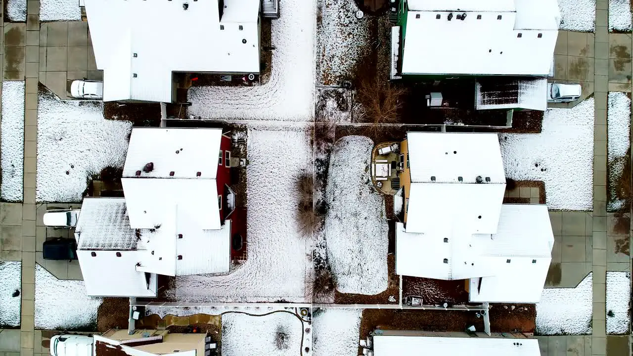 After a late March snowfall the rooftops of this suburban neighborhood are lightly covered in a coat of snow