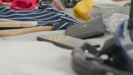 Close Up Of Open Suitcase In Bedroom At Home Being Packed For Summer Holiday